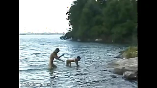 Hot naked bathers banging on the beach of the lake